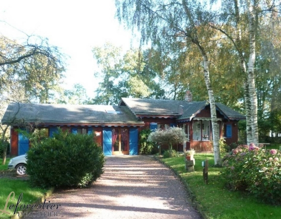 Maison ossature bois avec jardin fleuri en vente
